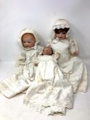 Three Armand Marseille bisque-headed dolls (one a/f).