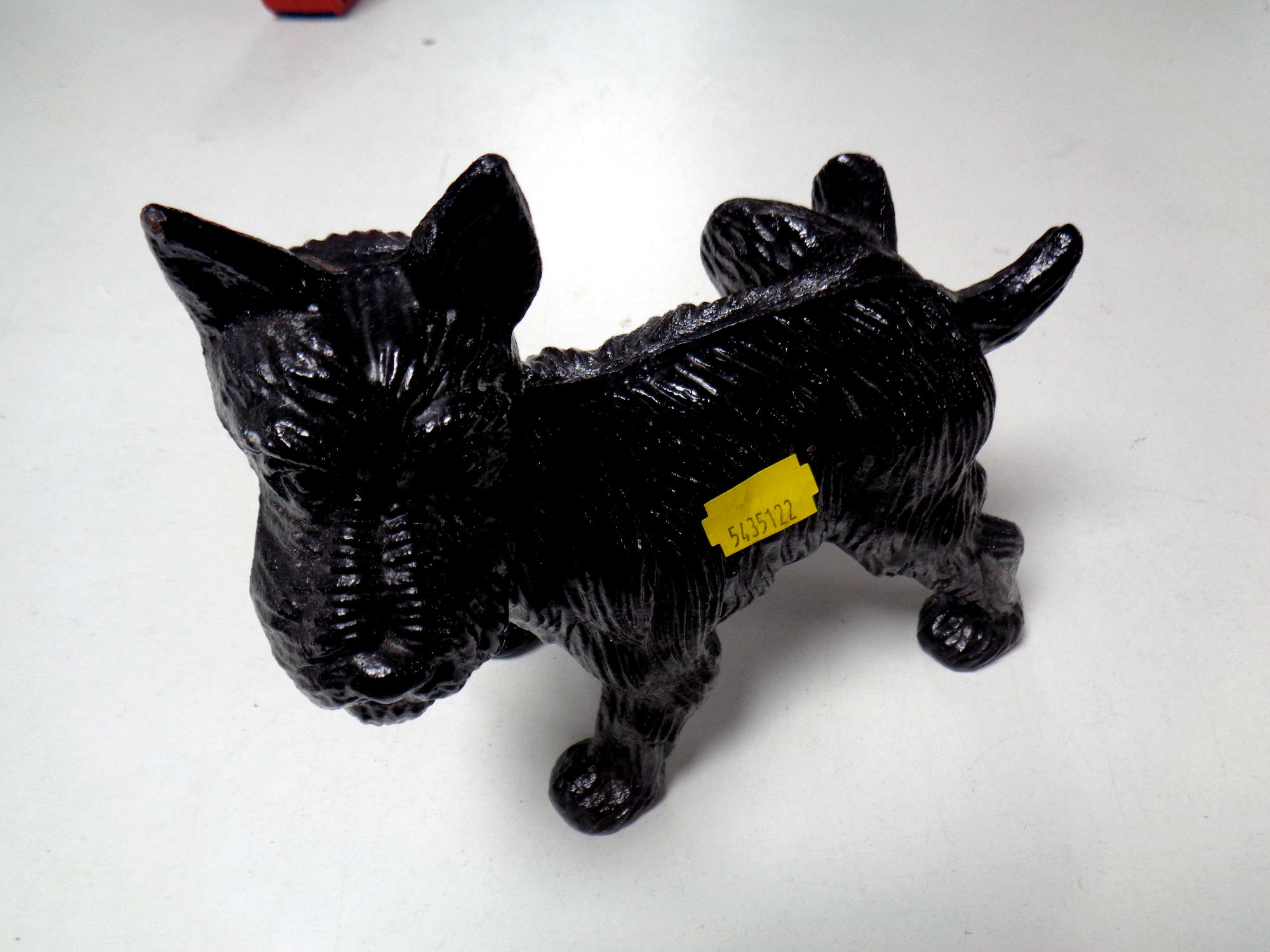 A cast iron doorstop in the form of a West Highland Terrier