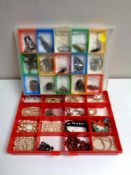 Two plastic display cases containing costume jewellery to include simulated pearls, necklaces,