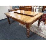 A nineteenth century oak wind out table with two leaves (no handle)