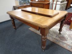 A nineteenth century oak wind out table with two leaves (no handle)