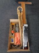 A box of draughtsman's squares, music stand, walking sticks, vintage hand tools.