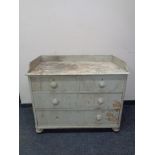 An antique painted pine four drawer chest (af)