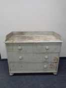 An antique painted pine four drawer chest (af)