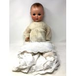 An Armand Marseille bisque-headed jointed doll stamped AM Germany,