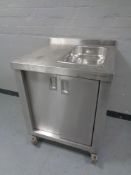 A commercial stainless steel double door food warming cabinet with bain marie, width 70cm.