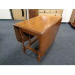 A 20th century oak gateleg table.