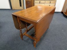 A 20th century oak gateleg table.
