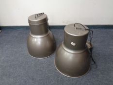 A pair of industrial style light fittings.