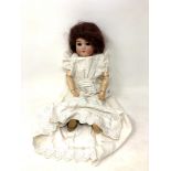 A German bisque-headed doll stamped Gbr 165K 11/2 Germany