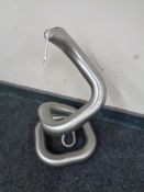 A metal sculpture of a snake.