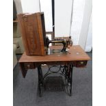A 20th century century New Home treadle sewing machine.