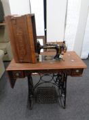 A 20th century century New Home treadle sewing machine.