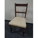 An Edwardian oak dining chair