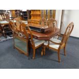 An American style twin pedestal extending dining table with two chairs together with a set of six