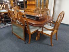 An American style twin pedestal extending dining table with two chairs together with a set of six
