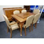 An eight piece walnut Queen Anne dining room suite comprising of inverted breakfront sideboard,