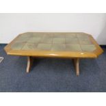An octagonal tile topped refectory coffee table