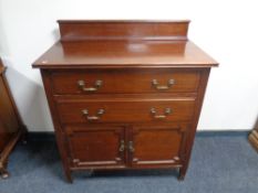 An Edwardian mahogany four drawer dressing chest together with matching linen chest.