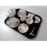 A tray containing eleven pieces of Royal Crown Derby 'Derby Roses' bone china to include a seven