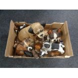 A box of a large quantity of composite dog figures.