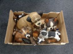 A box of a large quantity of composite dog figures.