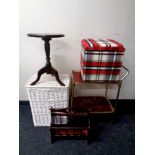 A gilt two tier tier trolley together with a wicker laundry basket, mahogany wine table,
