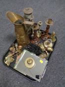 A tray of assorted brass wares, barley twist candlesticks, oil lamp,