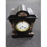 A 19th century black slate and marble mantel clock with enamelled dial.