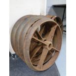 A set of four cast iron cart wheels