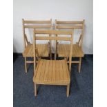 A set of eight folding kitchen chairs.