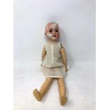 An Armand Marseille bisque-headed jointed doll stamped AM Germany 390 A2/0M (a/f)