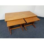 A nest of three 20th century teak G-Plan tables.