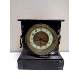 A 19th century marble and black slate mantel clock with brass and enamel dial