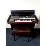 An Electrone electric organ with stool.