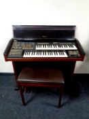 An Electrone electric organ with stool.