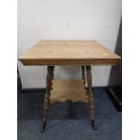 An Edwardian oak occasional table.