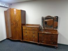 A three piece 20th century walnut bedroom suite comprising of serpentine front double door wardrobe,