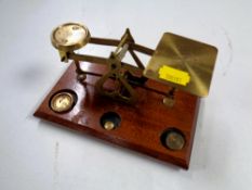 A set of antique brass postal scales.