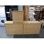 A pair of contemporary pine effect four drawer chests with matching bedside and similar bookshelves