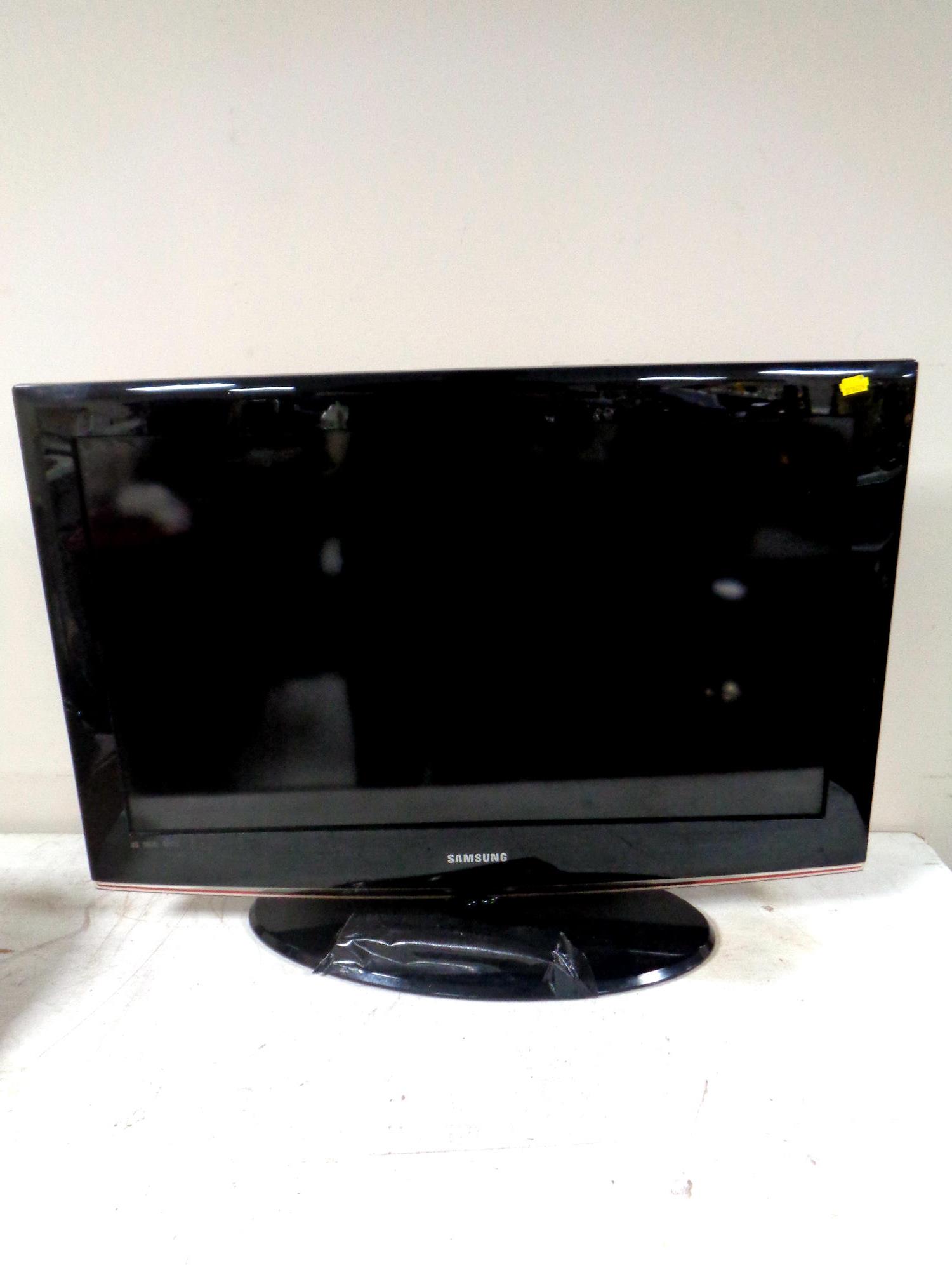 A Samsung 32" LCD TV with remote.