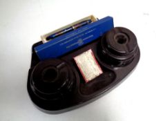 An early 20th century J S Press Ltd Bakelite inkwell together with a Waterman fountain pen and nibs,