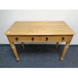 A Victorian pine side table fitted with two drawers