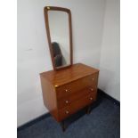 A mid 20th century teak three drawer chest together with a teak wall mirror.