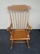 A beech spindle back rocking chair.