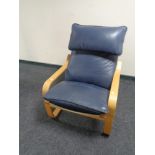 An Ikea beech framed blue leather armchair