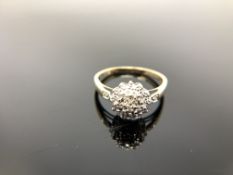 A 9ct gold diamond cluster ring, size T CONDITION REPORT: 2.