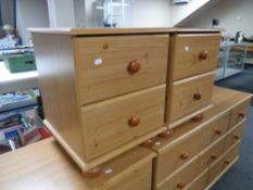 A pair of pine effect two drawer bedside chests