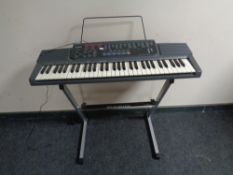 A Casio CTK-500 electric keyboard on stand with lead