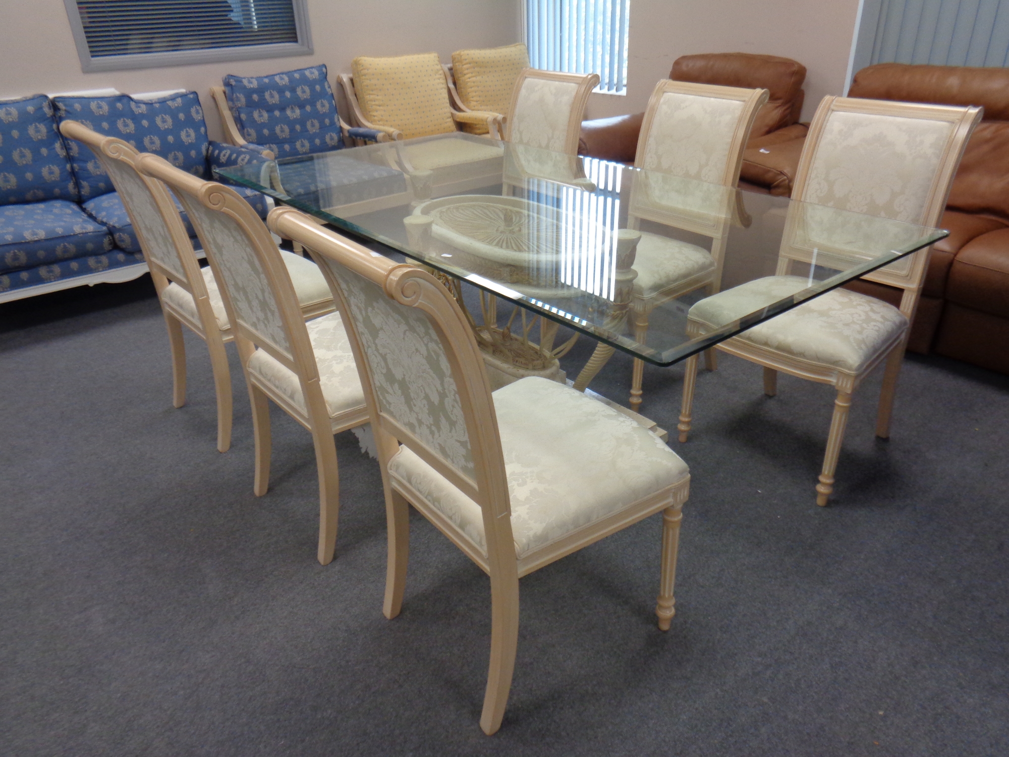 A Barker and Stonehouse Empire style glass topped pedestal dining table together with a set of six